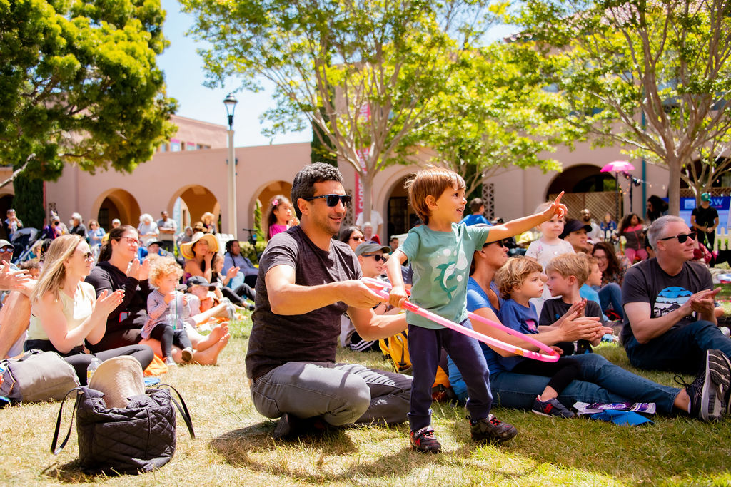 Audience members watching Hoopla! at WOW Festival 2022; photo by Jenna Selby.