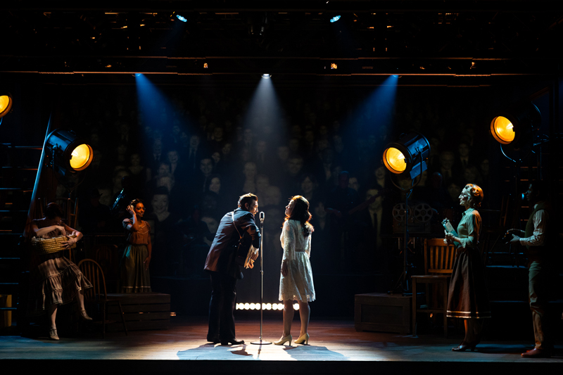 Christopher Ryan Grant as “Johnny Cash” and Patti Murin as “June Carter Cash” with the cast of La Jolla Playhouse’s world-premiere production of THE BALLAD OF JOHNNY AND JUNE; photo by Rich Soublet II.